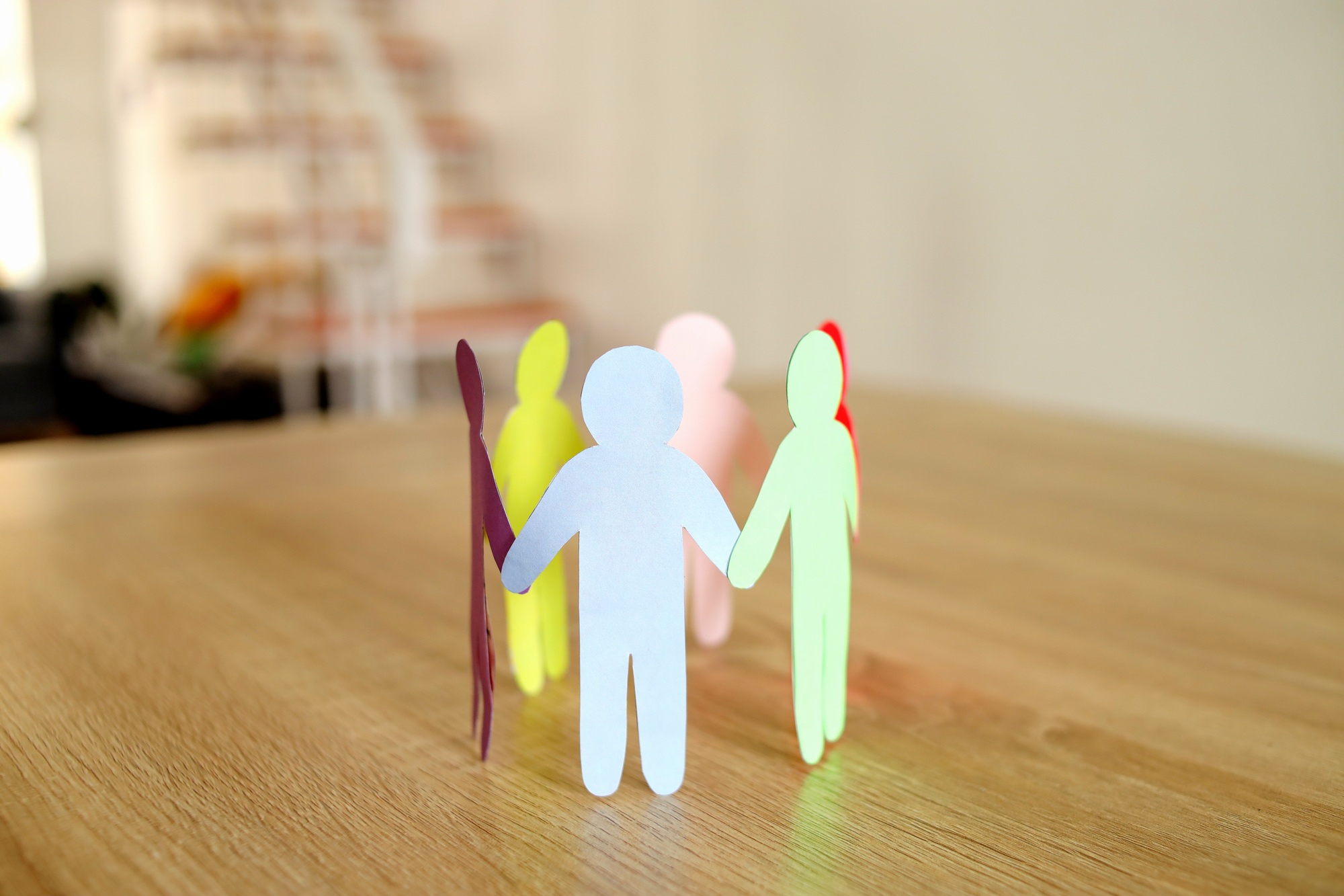 Colorful Paper Human Figures Making Circle